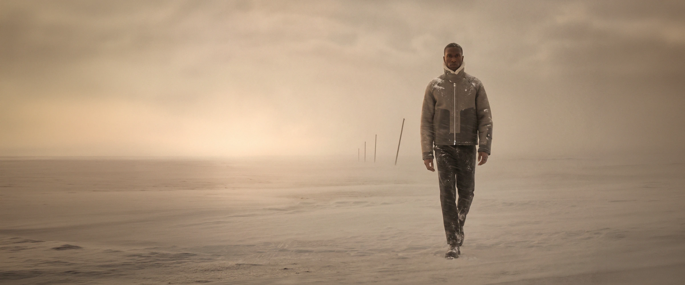 Editorial campaign still, figure centred in a landscape setting.